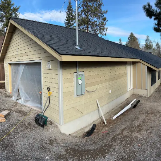 Exterior view of the new home built in Bend, Oregon. With freshly installed siding.