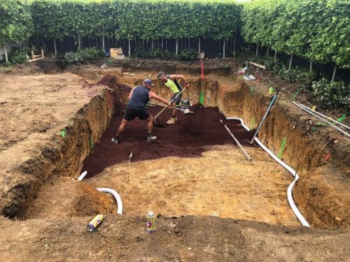 Finished retaining wall holding back clay on a Kumeū hillside