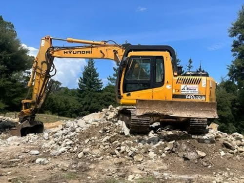 AJLC excavator clearing and preparing a residential site in West Auckland