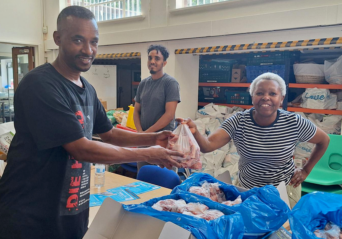 Photo of Habtom volunteering at Migrant Help