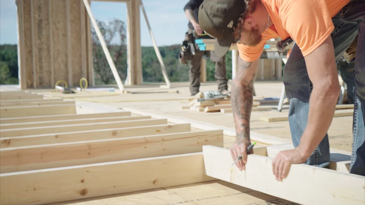 Carpenter laying out framing lumber for remodeling and renovation in Union, MO