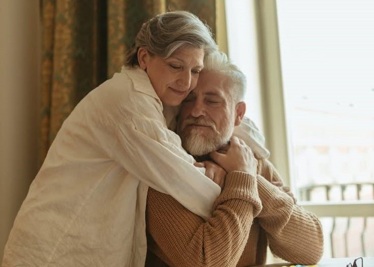 Happy retired couple embracing