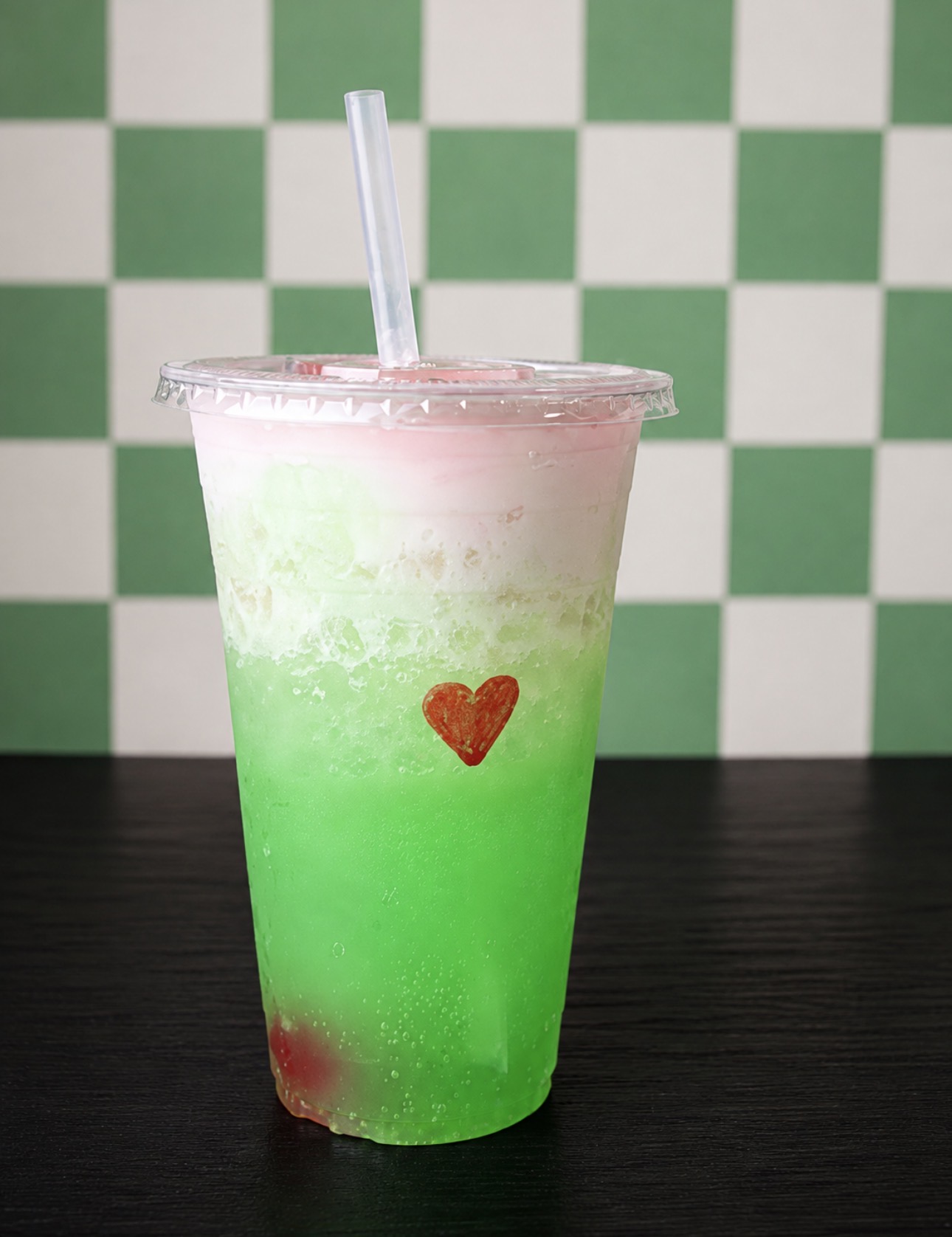 Green specialty drink in a clear cup, supplied by Twist & Sip Refreshments