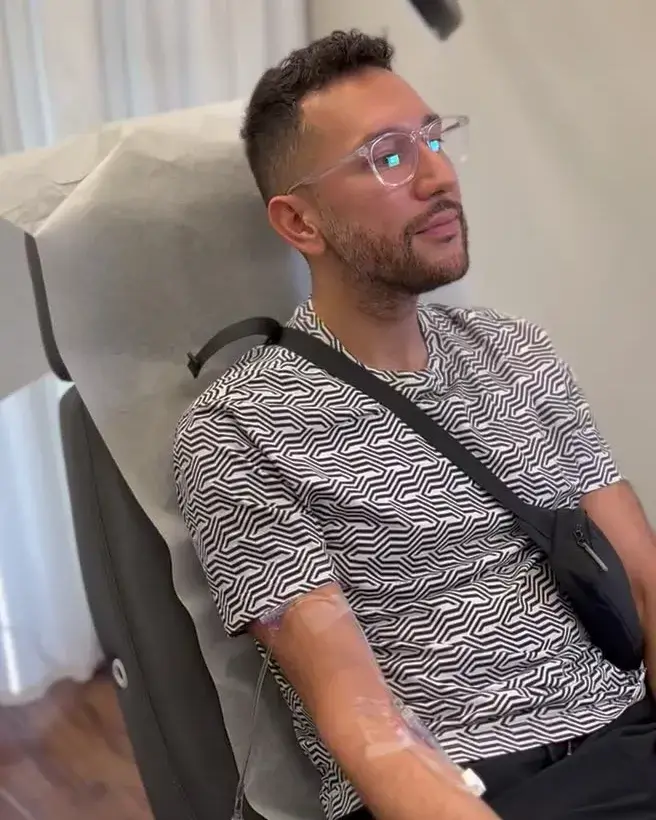 Man relaxing in a treatment chair while receiving NAD+ IV nutrient therapy at Chrome Aesthetics. Man relaxing in a treatment chair while receiving NAD+ IV nutrient therapy at Chrome Aesthetics.