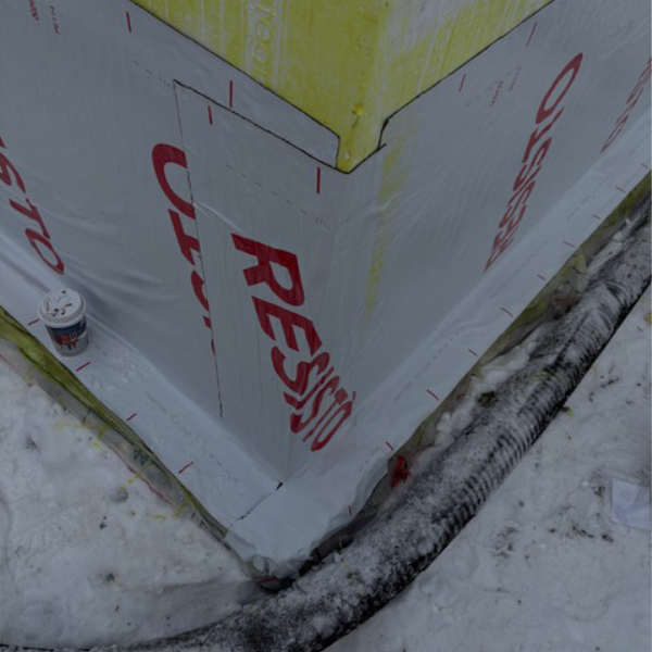 Foundation waterproofing membrane on a Farwes addition in winter
