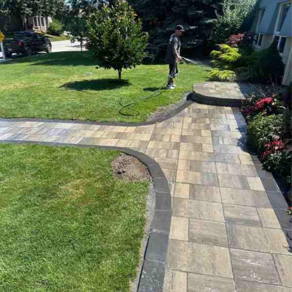 New interlock walkway and garden bed at a Farwes renovation