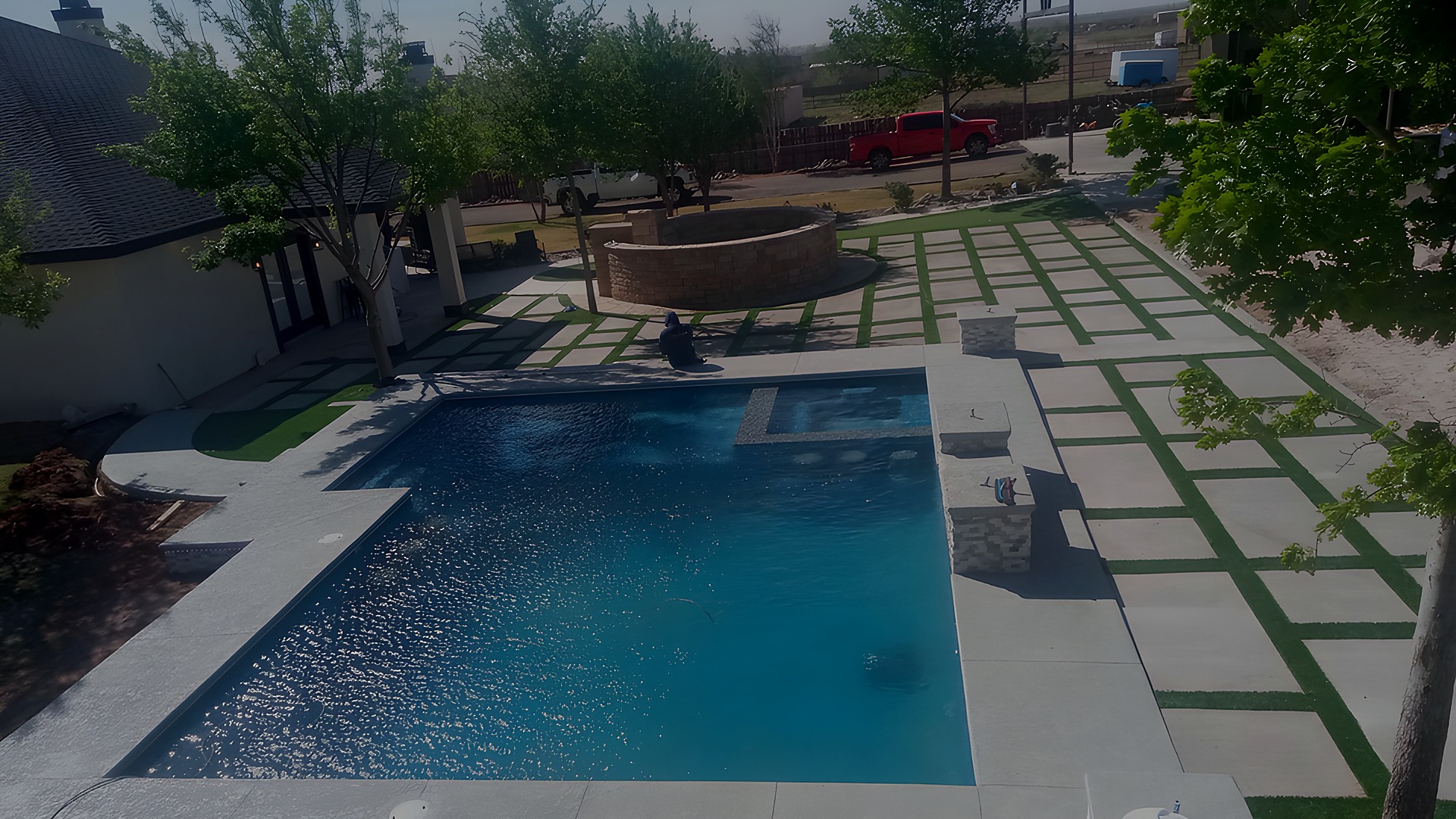 Pool with paver and turf grid deck in El Paso, TX