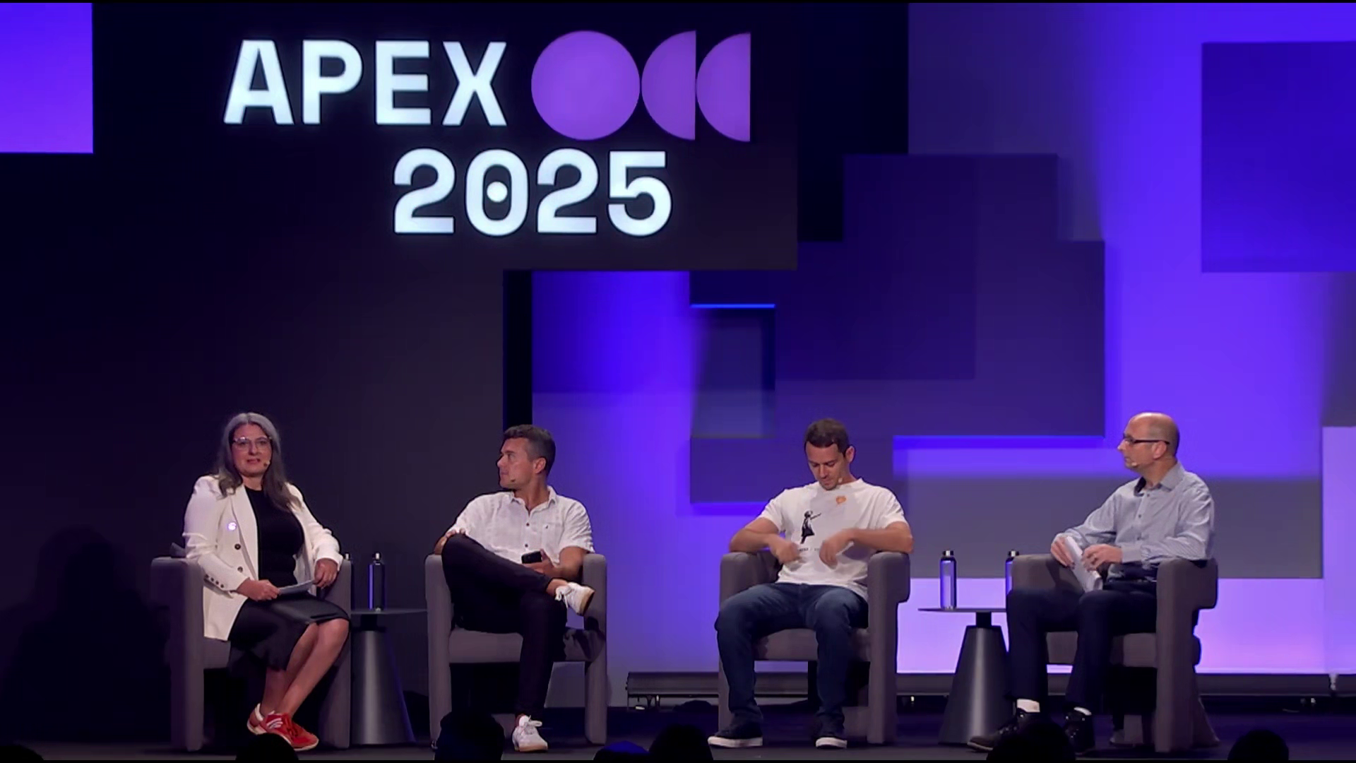 Dani Draper moderating a panel and fireside conversation