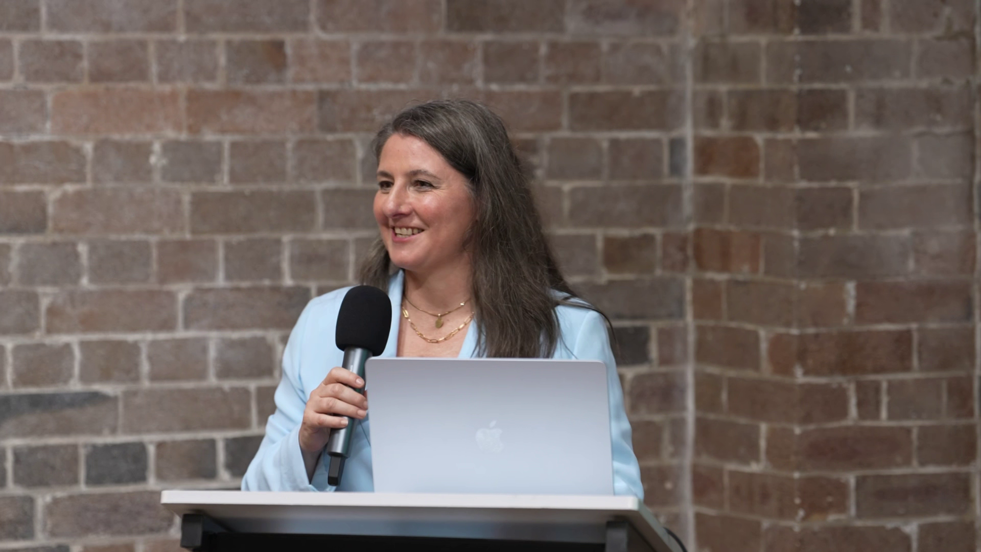 Dani Draper hosting and emceeing on stage