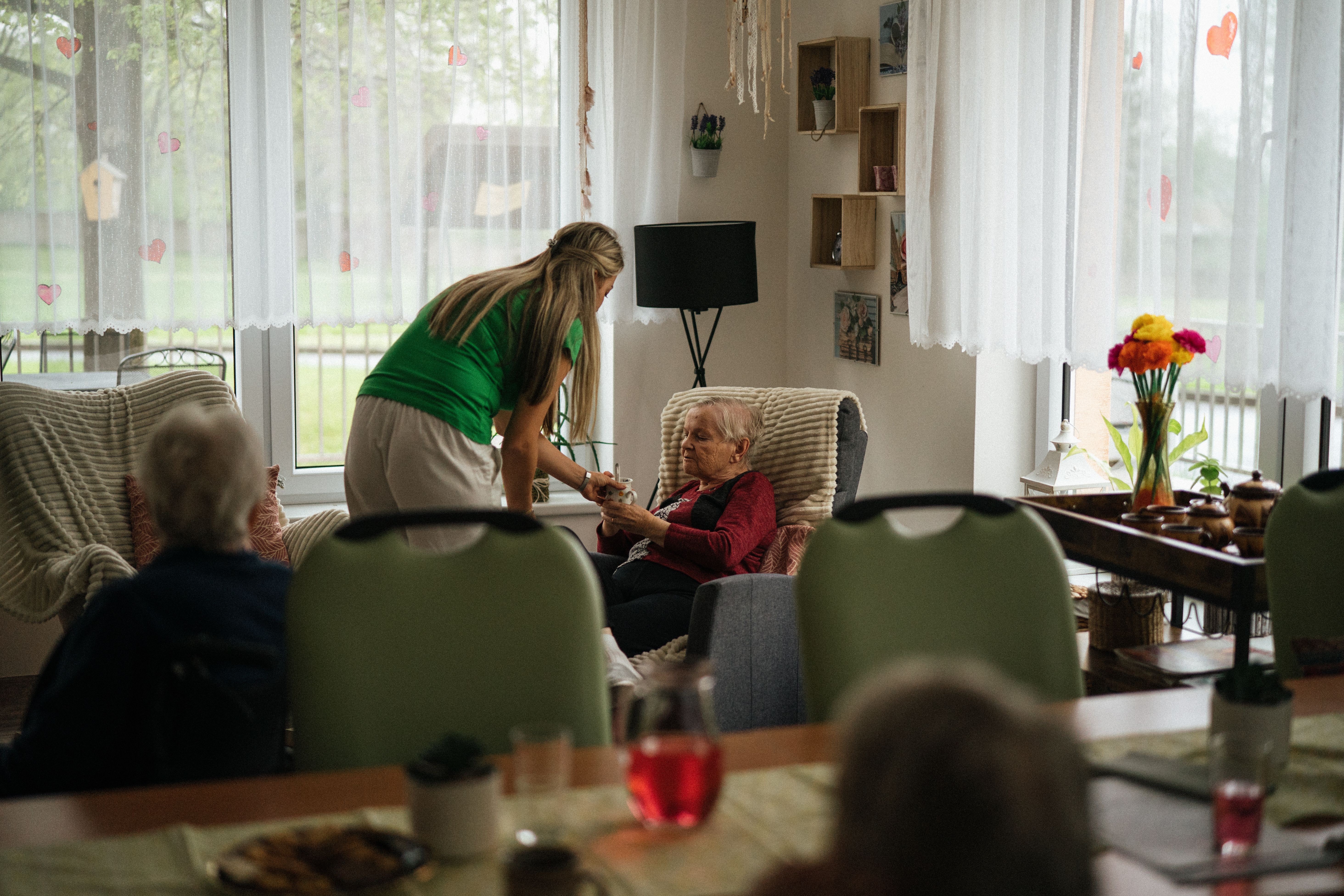 Caregiver helping client with personal care