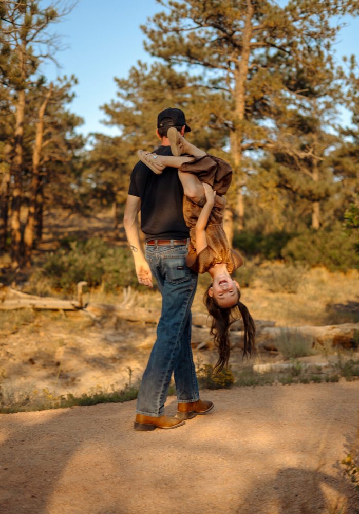 Father lifting his daughter