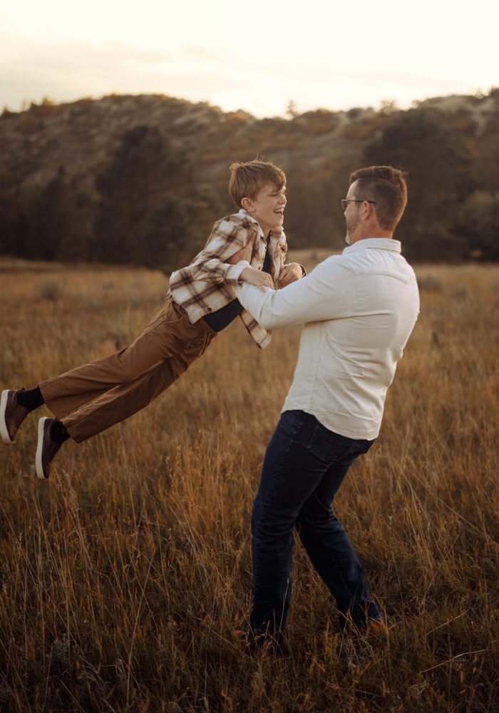 Father swinging his son