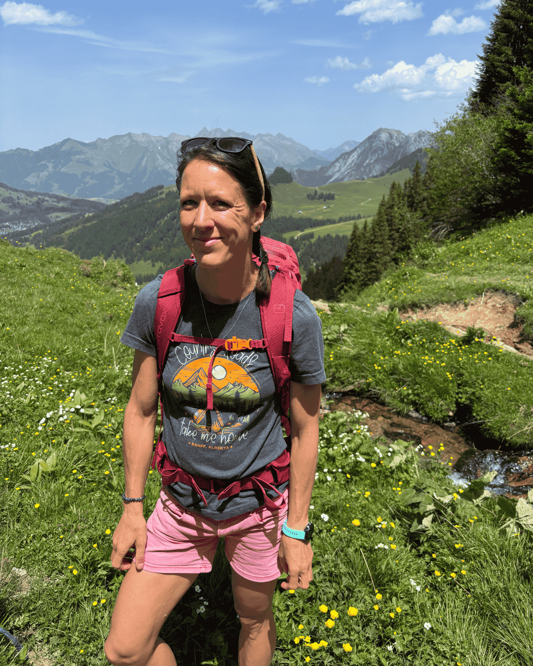 smiling woman hiking mountains