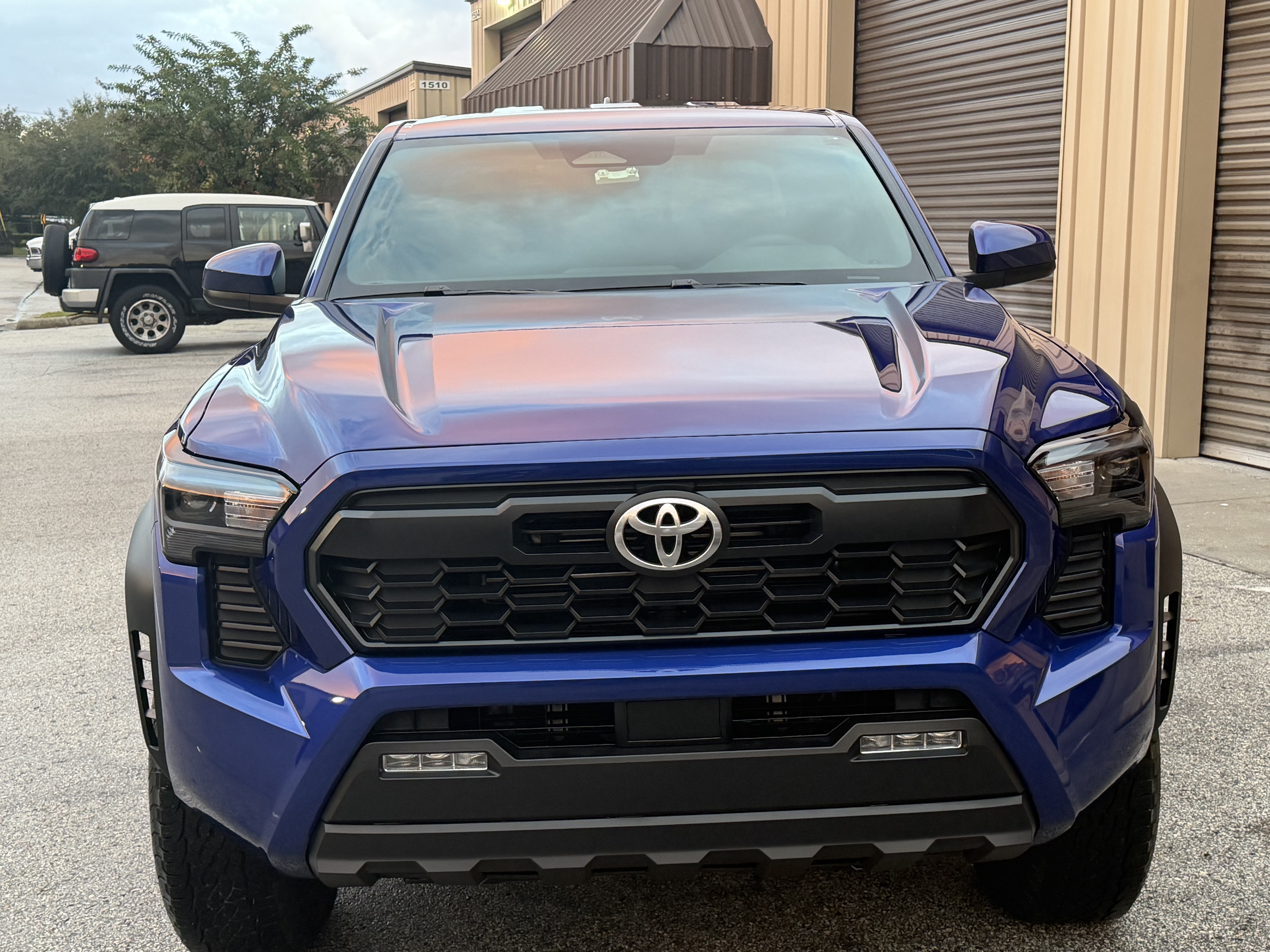 Blue Toyota Tacoma front view