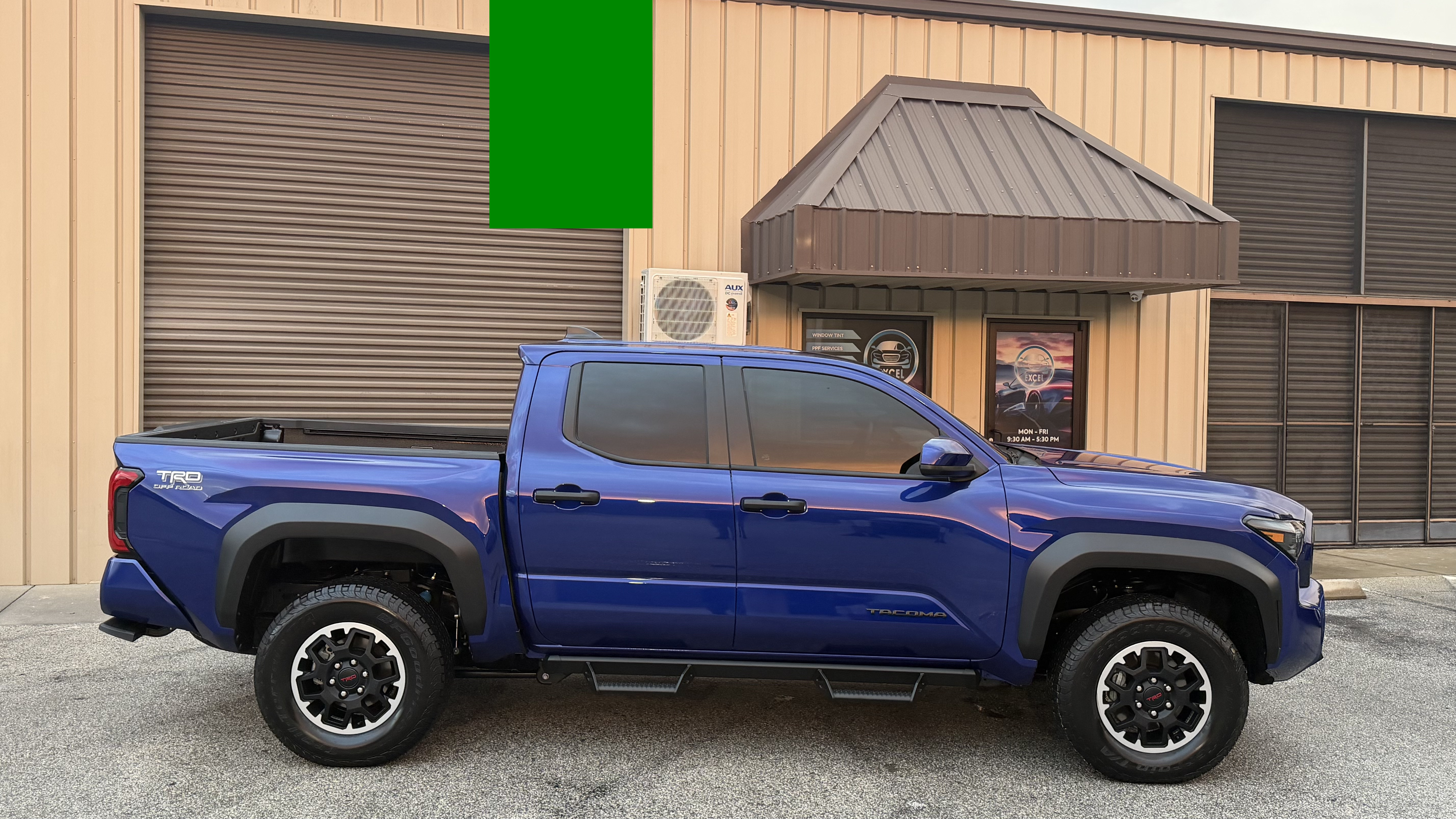 Blue Toyota Tacoma side view