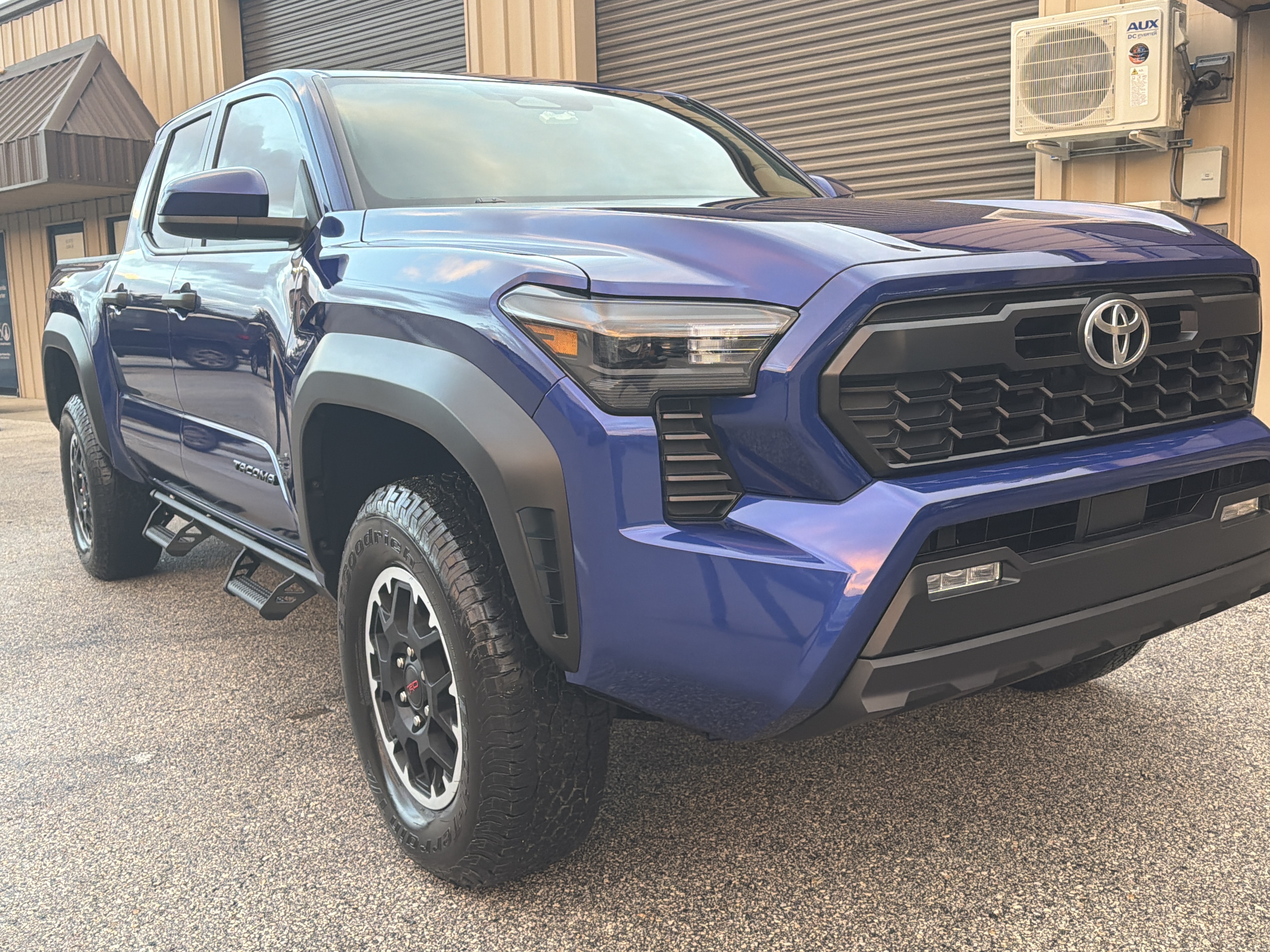 Blue Tacoma wheel and side detail