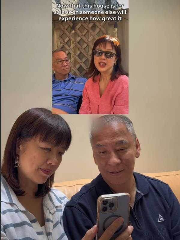 Winnie and John reading a client's message after a sale