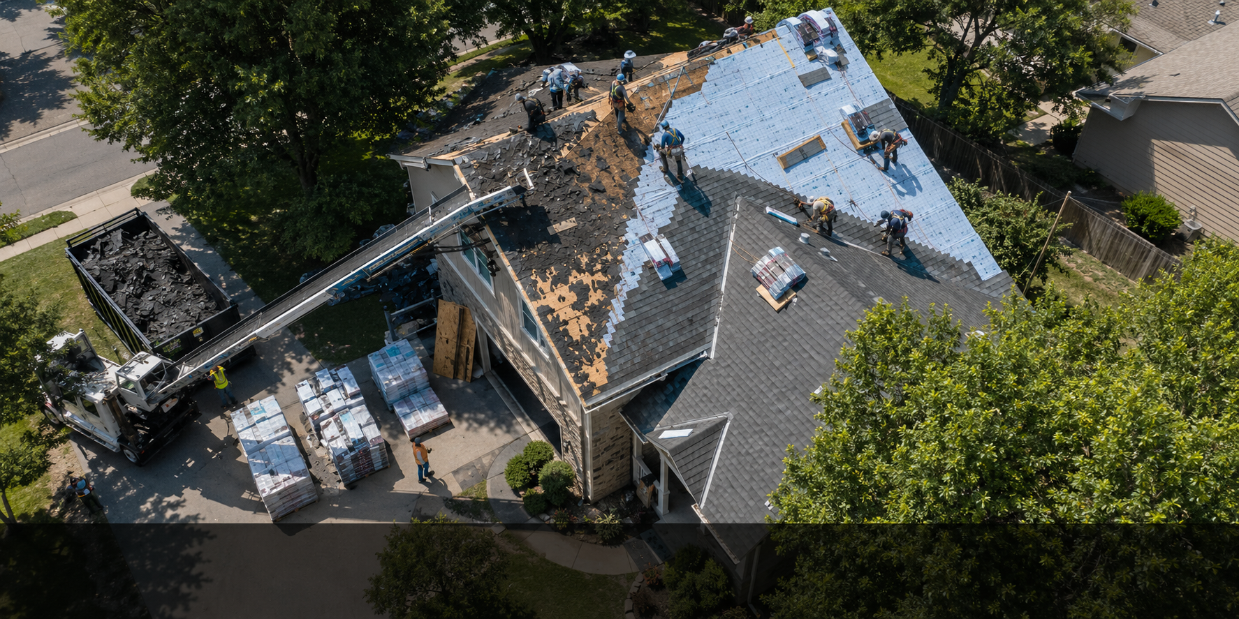 Why is roofing so expensive — overhead view of a full replacement in progress