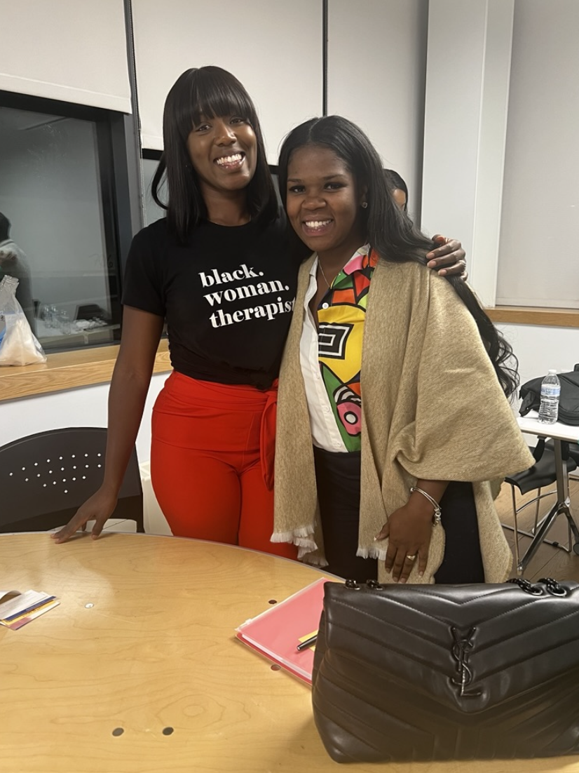 Assata with people at a community event