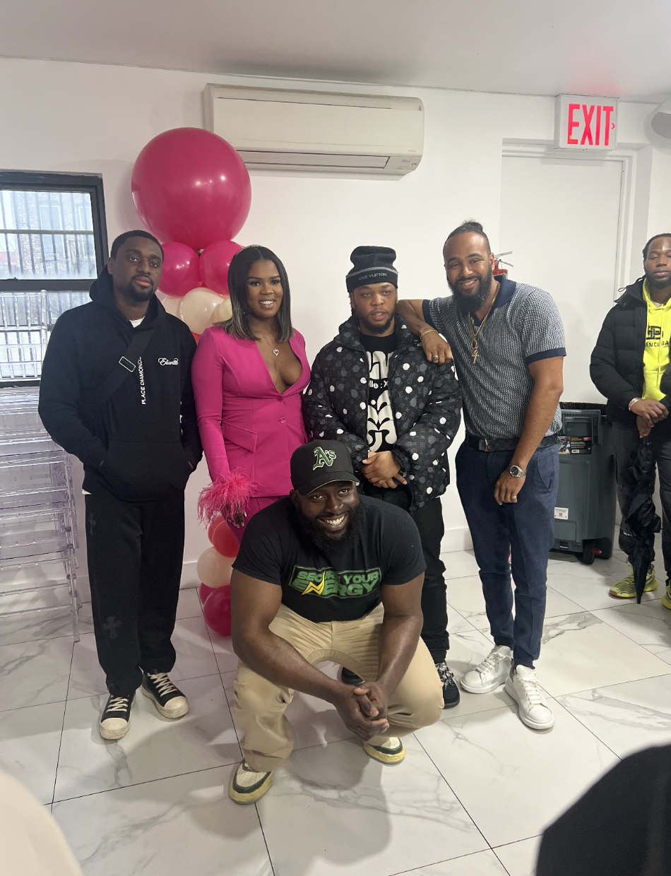 Assata with people at a community event