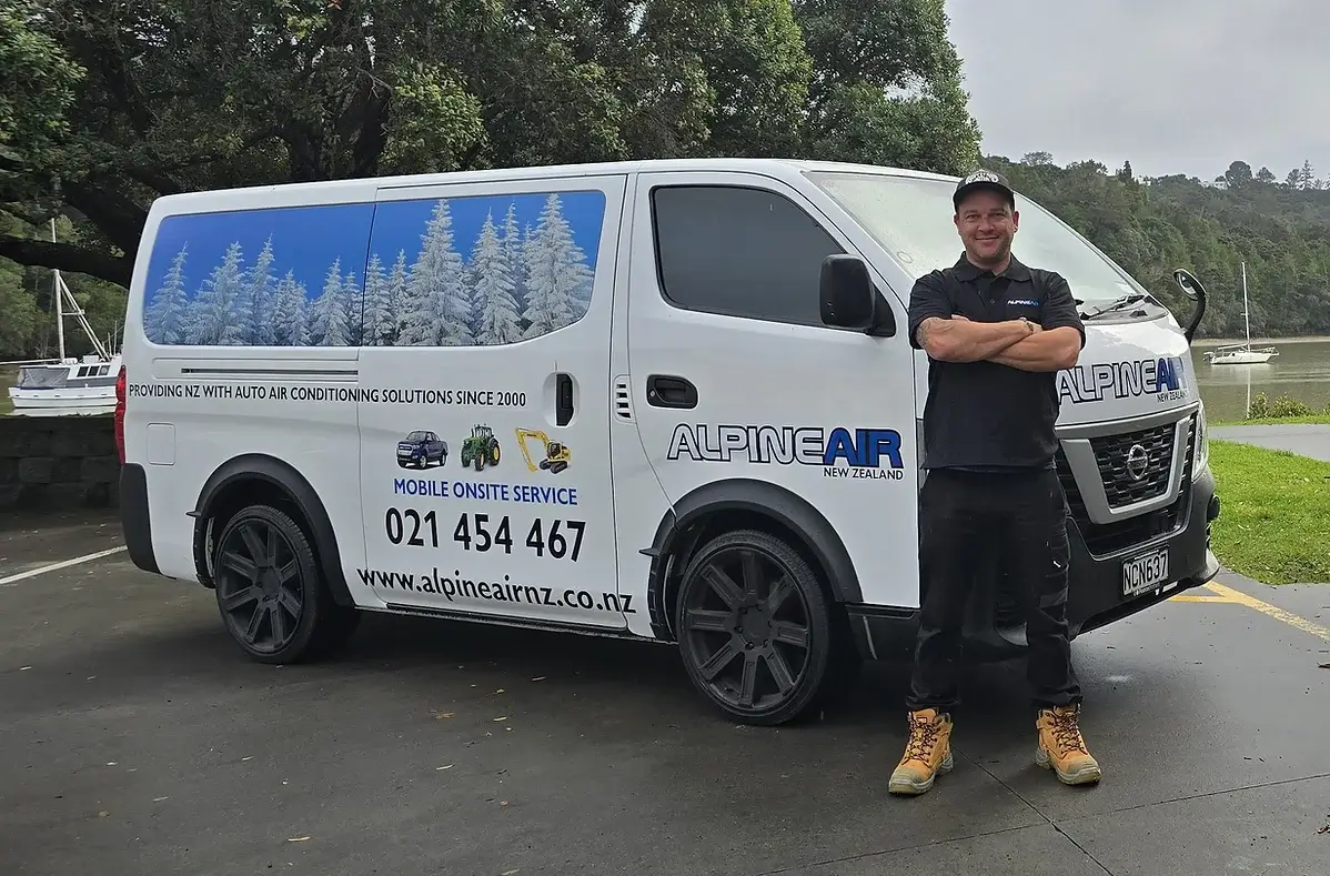 Owner of Alpine Air next to work vehicle