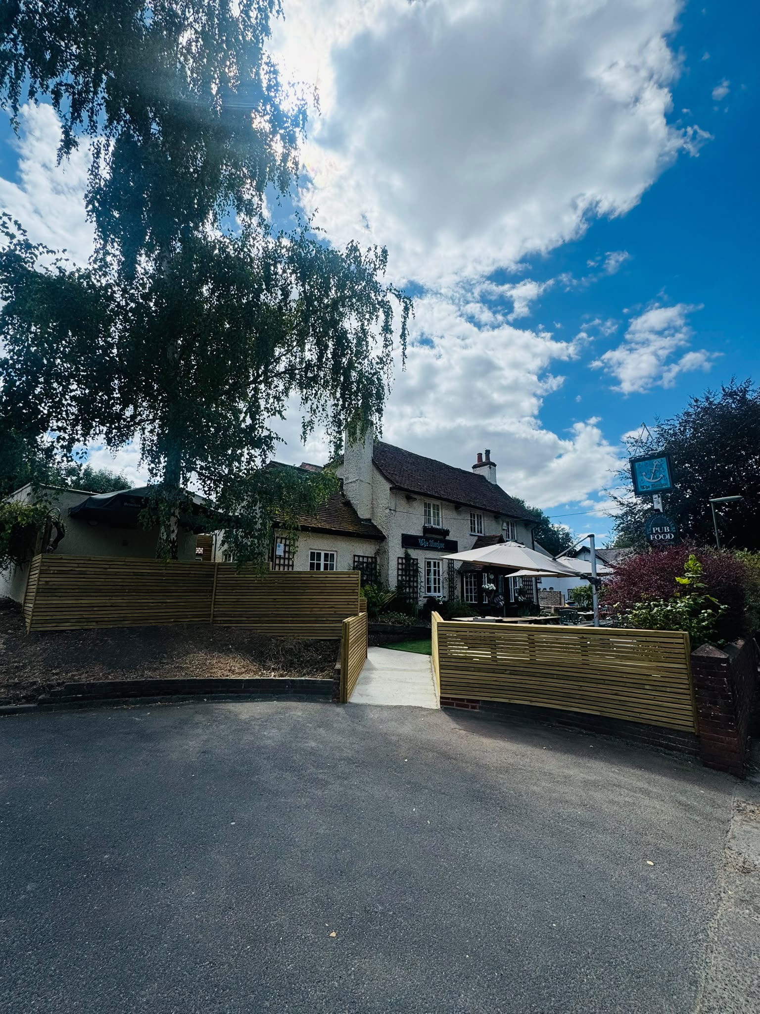 The Anchor Bookham pub exterior and beer garden, a popular spot for dog walkers in Surrey
