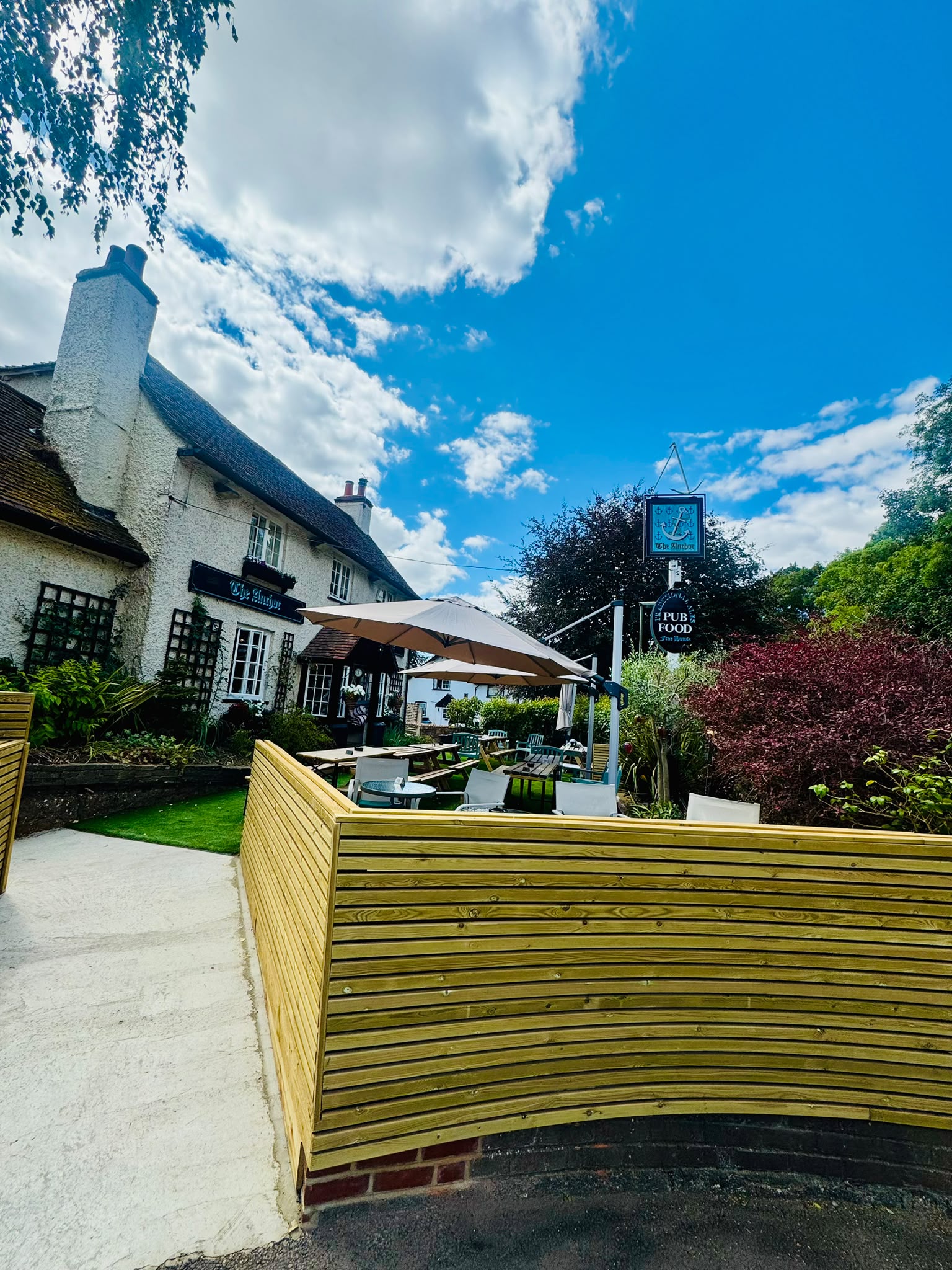 The Anchor Bookham pub exterior with its hanging sign