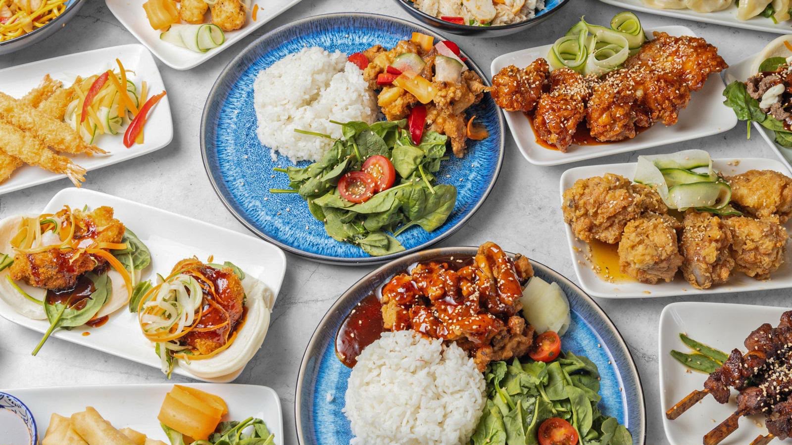 A spread of authentic Japanese and Korean dishes cooked fresh at The Anchor Bookham