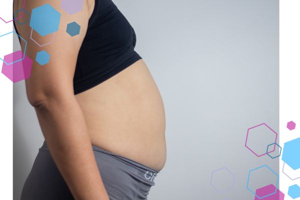 Early pregnancy abdomen showing subtle bloating and body changes in the first trimester. Early pregnancy abdomen showing subtle bloating and body changes in the first trimester.