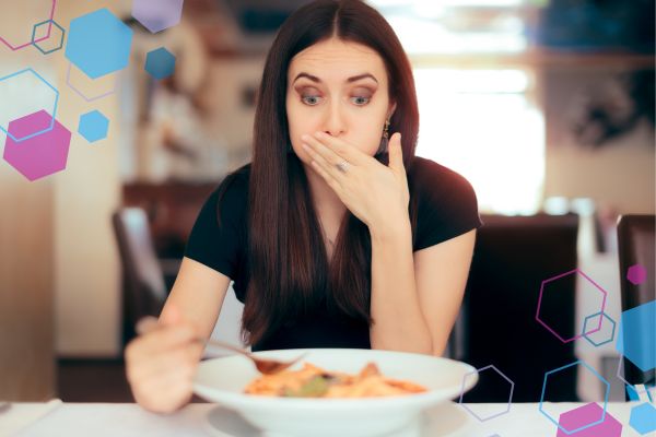Person reacting to food with a surprised expression, representing metallic or unusual taste in early pregnancy around 5–9 weeks. Person reacting to food with a surprised expression, representing metallic or unusual taste in early pregnancy around 5–9 weeks.