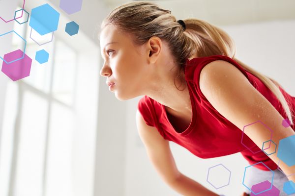 Person leaning forward with hands on their knees, illustrating feeling out of breath or breathless in early pregnancy. Person leaning forward with hands on their knees, illustrating feeling out of breath or breathless in early pregnancy.