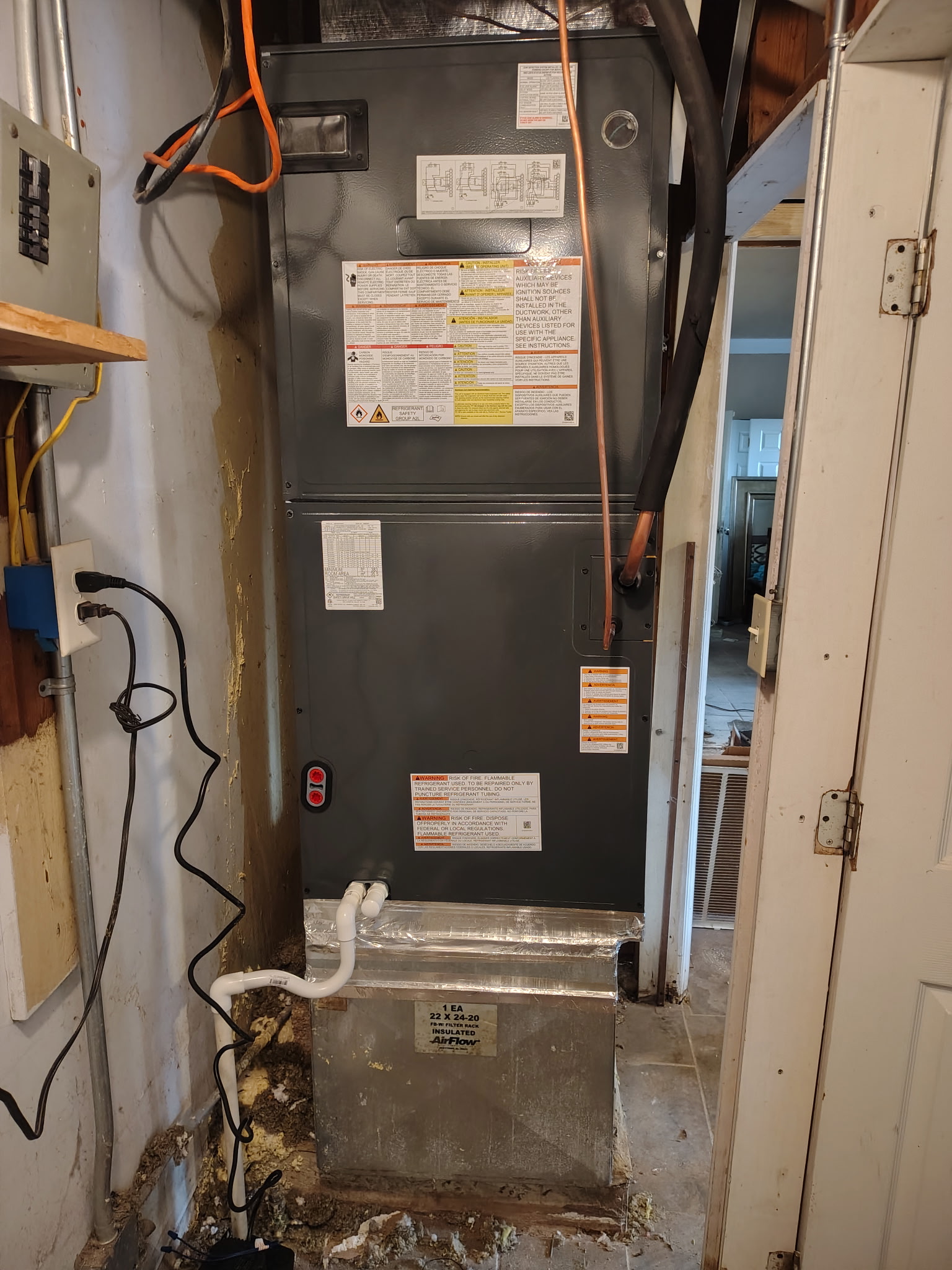 En Route Heating and Cooling technician working on a furnace in Birmingham, Alabama