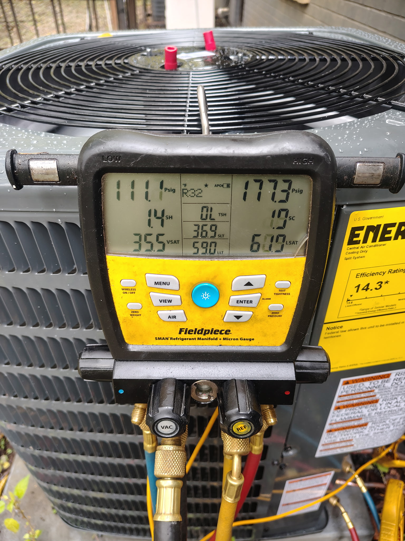 En Route Heating and Cooling technician doing a maintenance check on a unit in Birmingham, Alabama