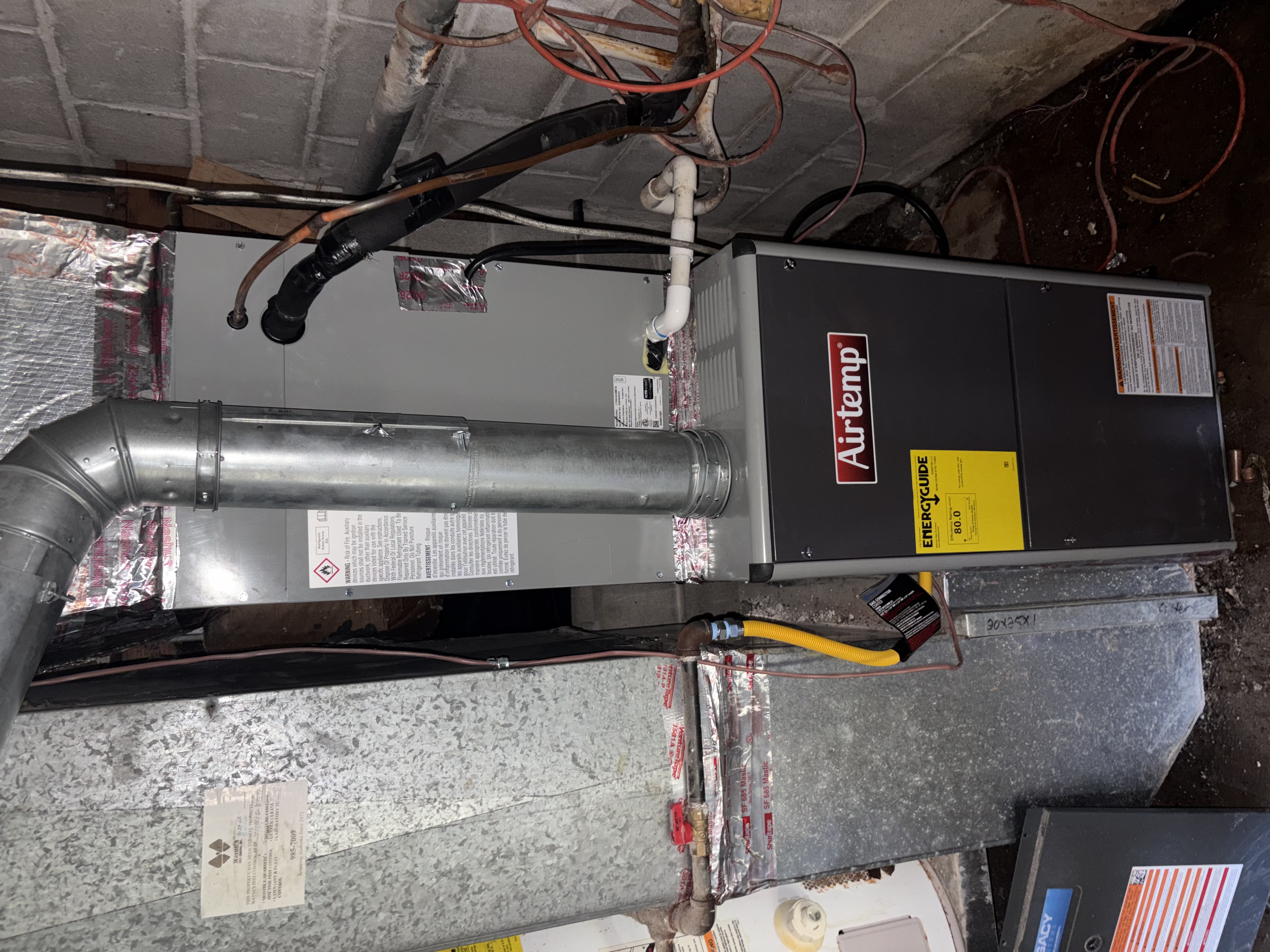 En Route Heating and Cooling technician working on ductwork in Birmingham, Alabama