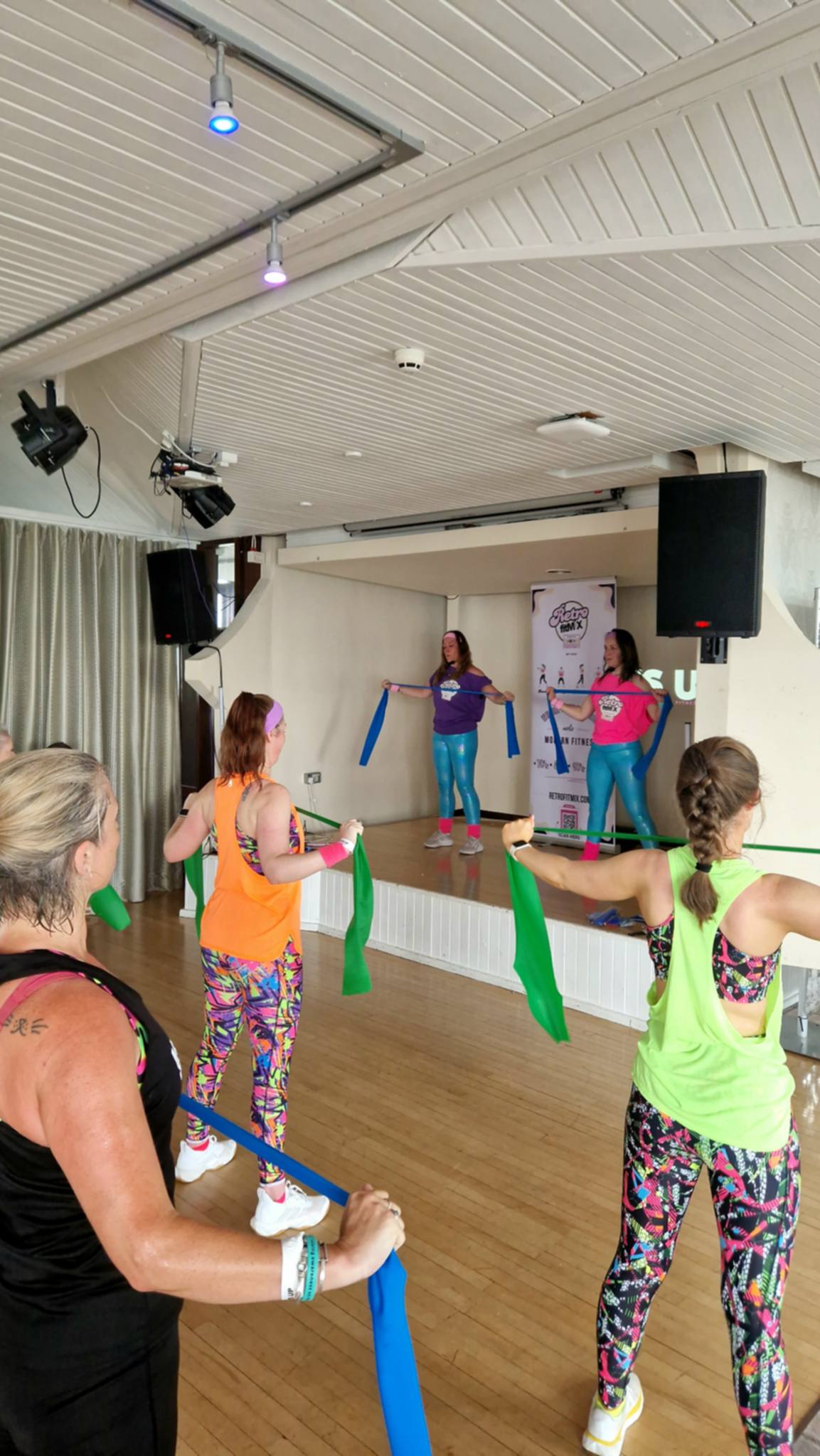 Donna Cuthbertson and Andrea leading a colourful RetroFitMix resistance-band fitness class Donna Cuthbertson and Andrea leading a colourful RetroFitMix resistance-band fitness class
