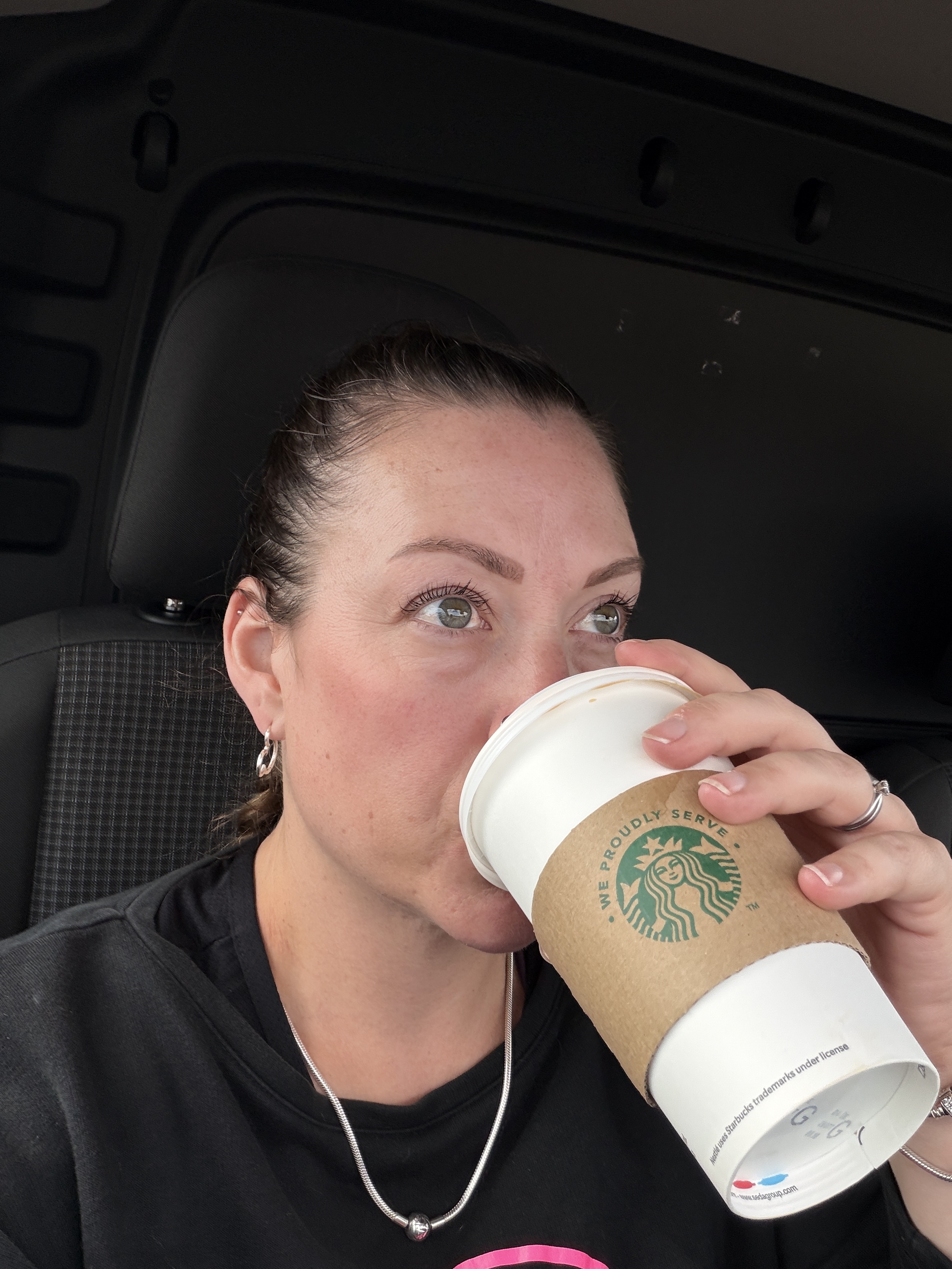 Donna sitting outside the Little Kirk with a coffee during an overloaded midlife morning Donna sitting outside the Little Kirk with a coffee during an overloaded midlife morning