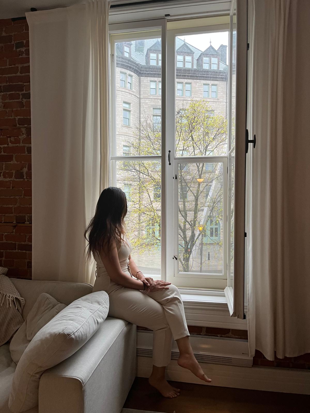 Woman holding her hands above her head