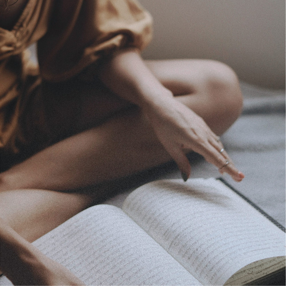 Woman writing in a notebook