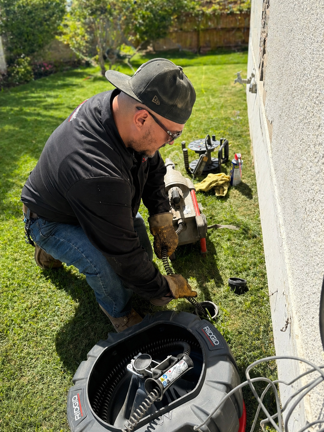 A3 Plumbing clearing a drain line