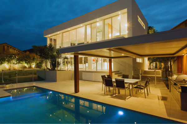 Multi-level luxury deck with built-in seating and lighting.