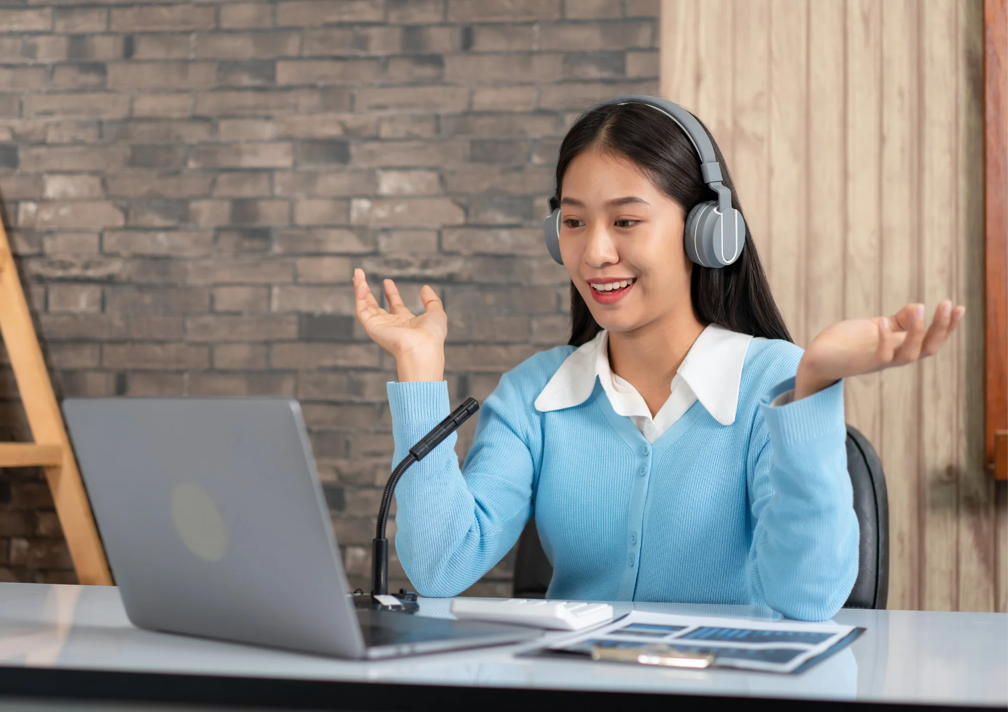 Online tutor teaching from home with laptop and headset