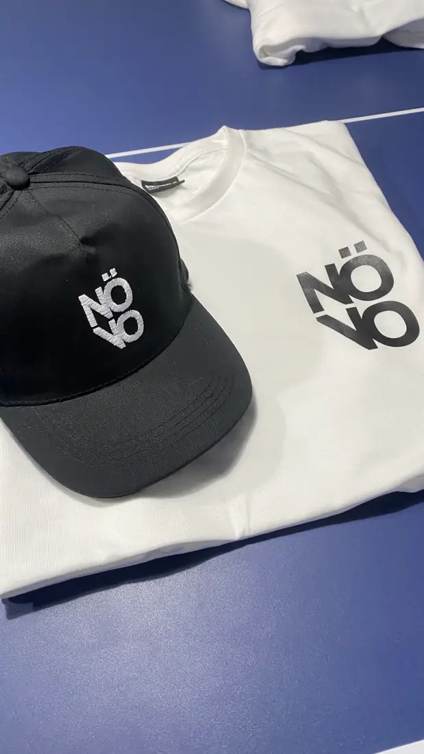 Embroidered cap and tee by Andy Jones Design & Print
