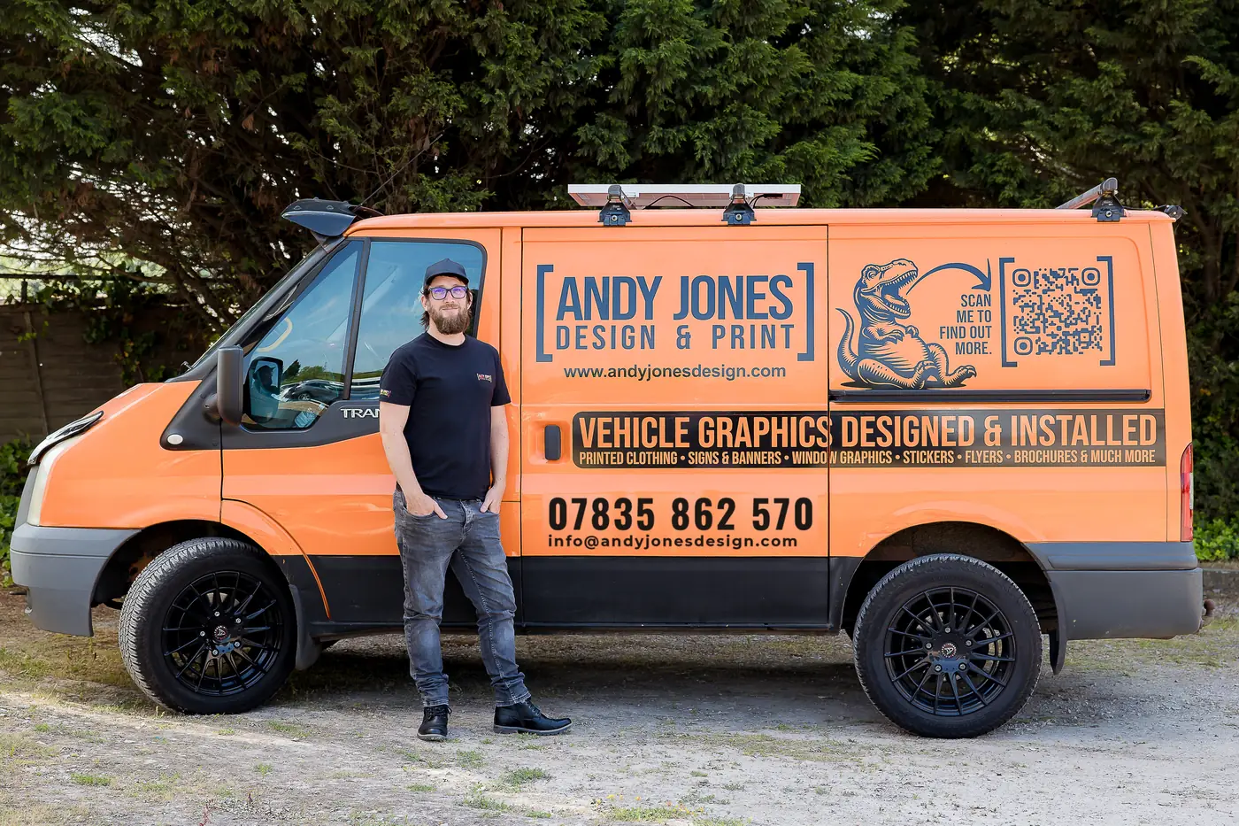 Andy Jones standing next to his branded van