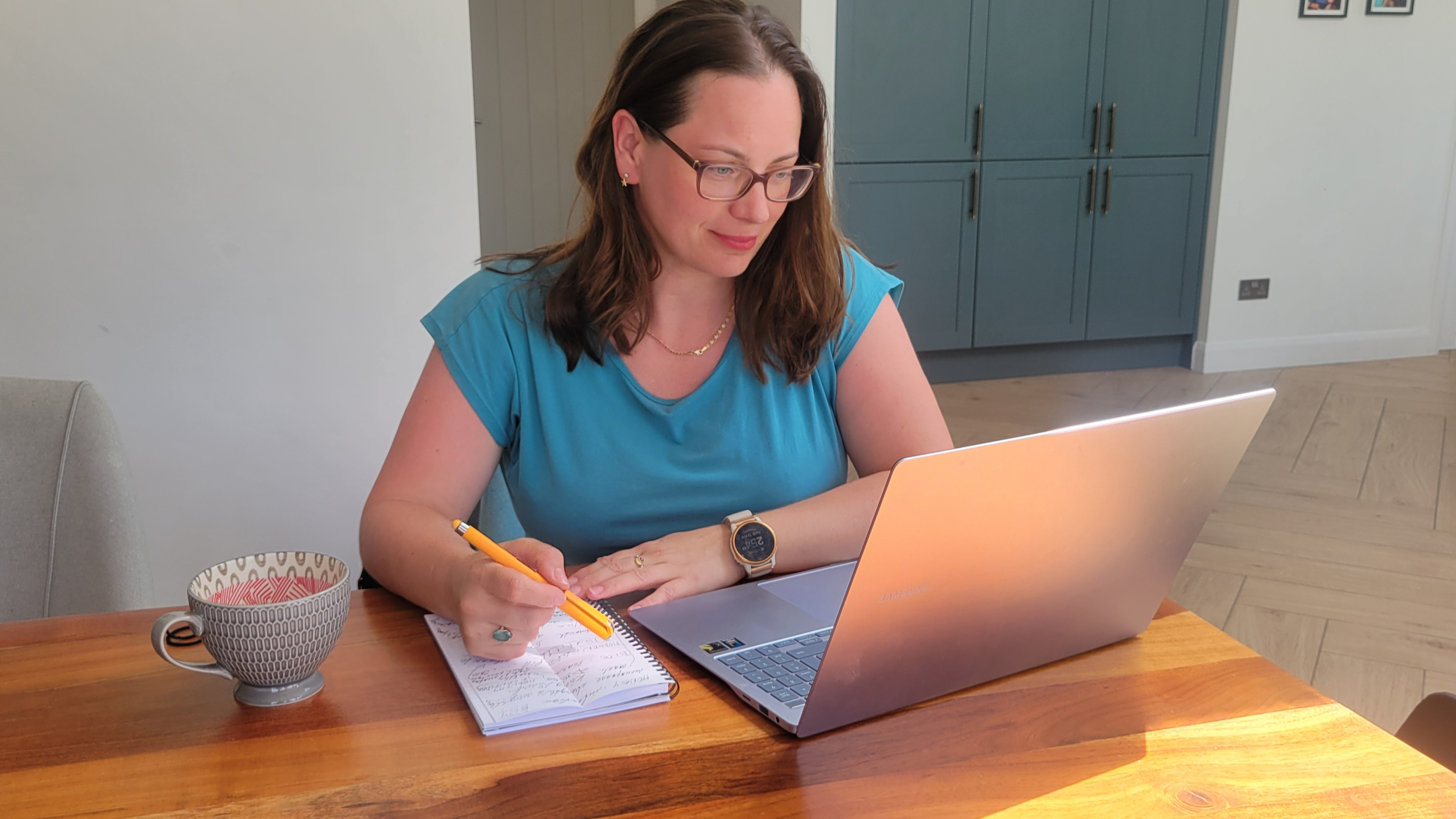 Eva at her laptop researching personal trainer and health coach SEO competitors in Kingston upon Thames