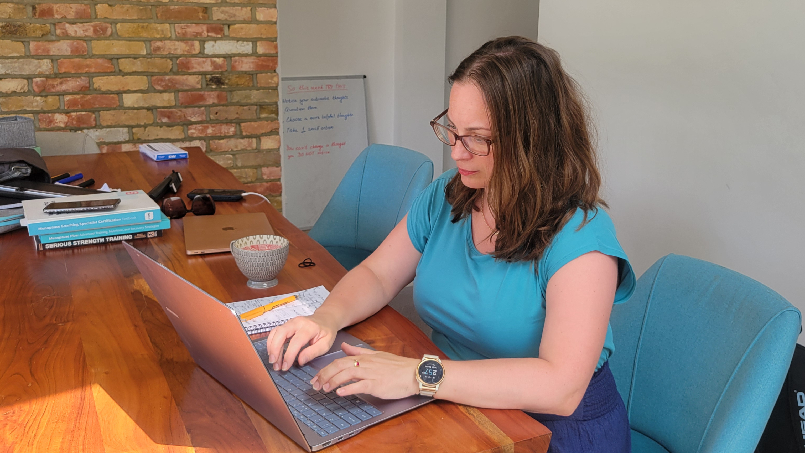 Eva working at her laptop mapping out a client's automation priorities Eva working at her laptop mapping out a client's automation priorities