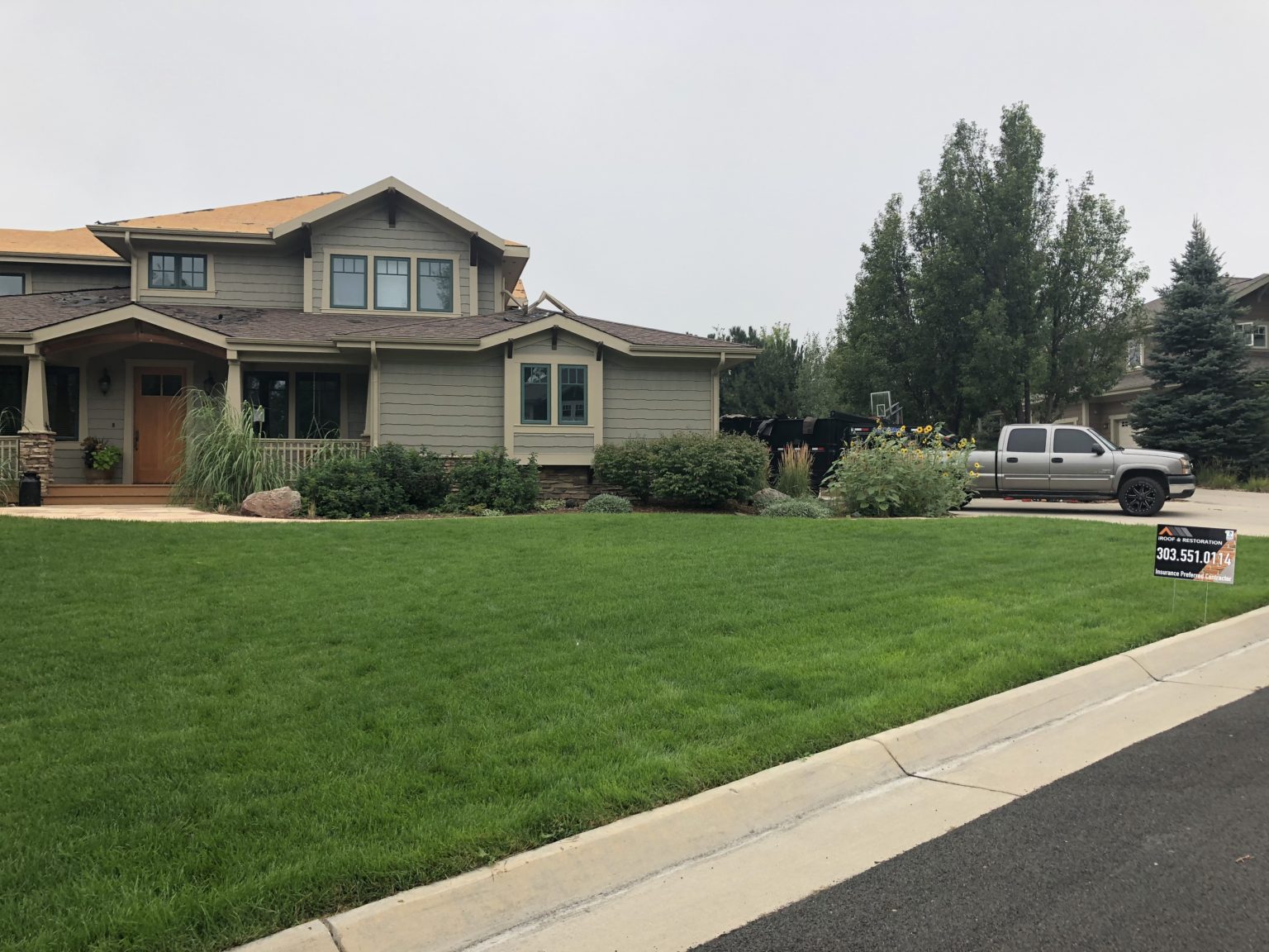 A home with a newly completed iROOF & RESTORATION roof