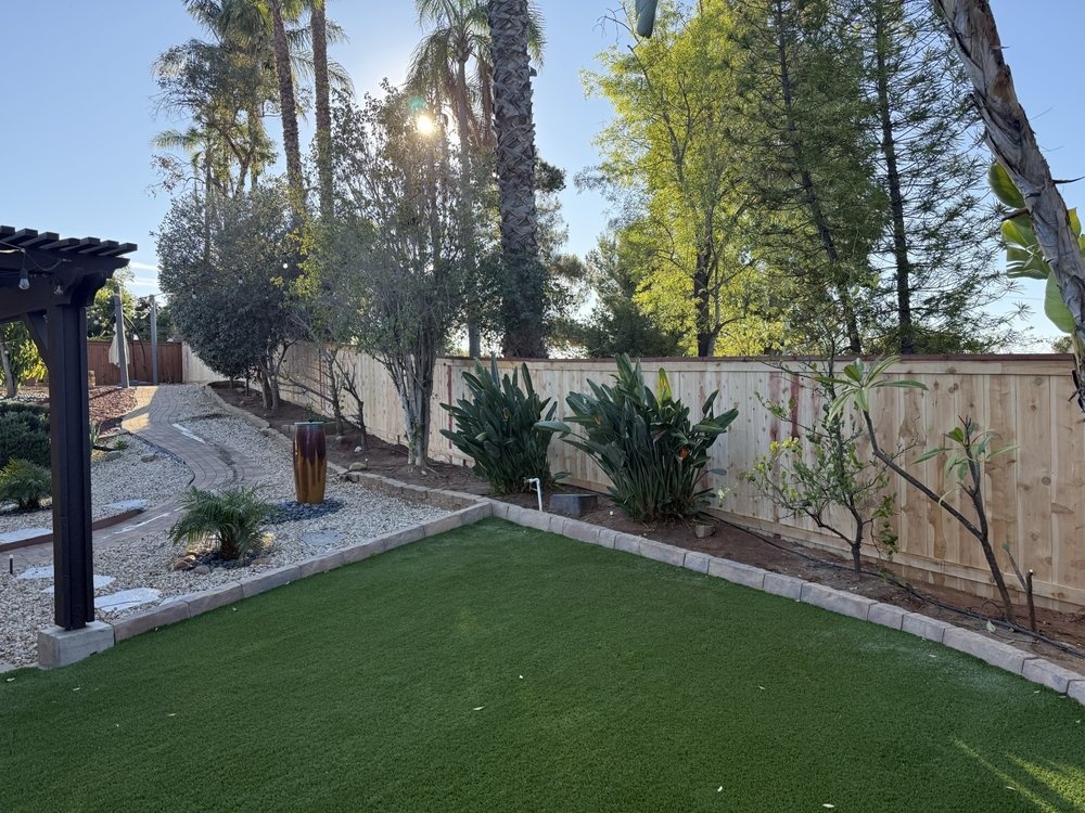 Landscaped wood privacy fence project by Islas Fencing