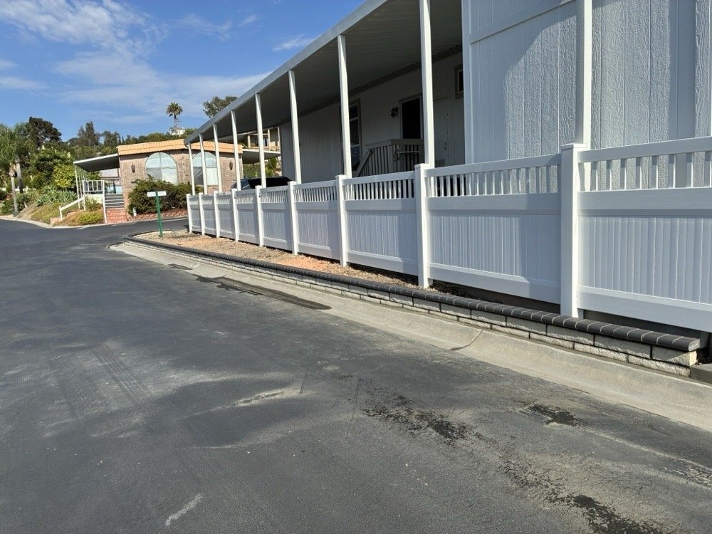 Decorative white vinyl fence project by Islas Fencing