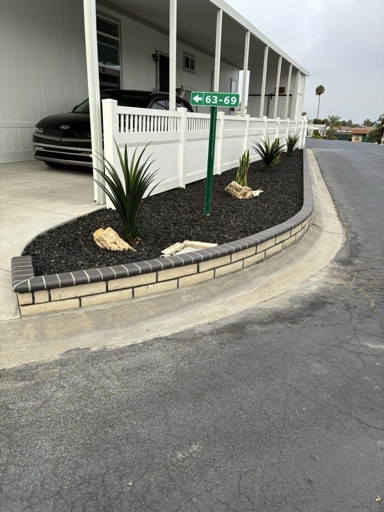 Residential vinyl fence and retaining wall project by Islas Fencing