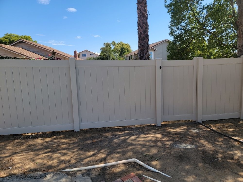 Decorative white vinyl fence project by Islas Fencing